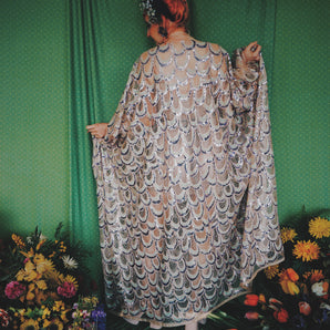 Snowdrops, lilacs, mermaids and horseshoes sequin kaftan gown