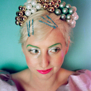 Metallic gold green and white bauble headdress