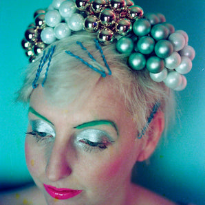 Metallic gold green and white bauble headdress